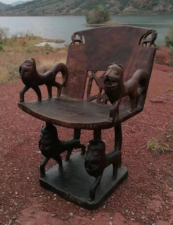 Chair and table of a dignitary in carved wood from Benin, 1950