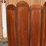 Art Deco screen with 7 panels carved with the insignia of the Foreign Legion, circa 1940