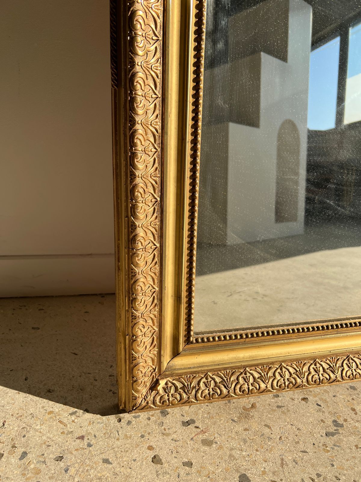 Gilded mirror with frieze h2m10 l:73cm