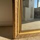 Gilded mirror with frieze h2m10 l:73cm
