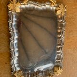 Silver metal top and decoration of foliage and handles in vintage brass