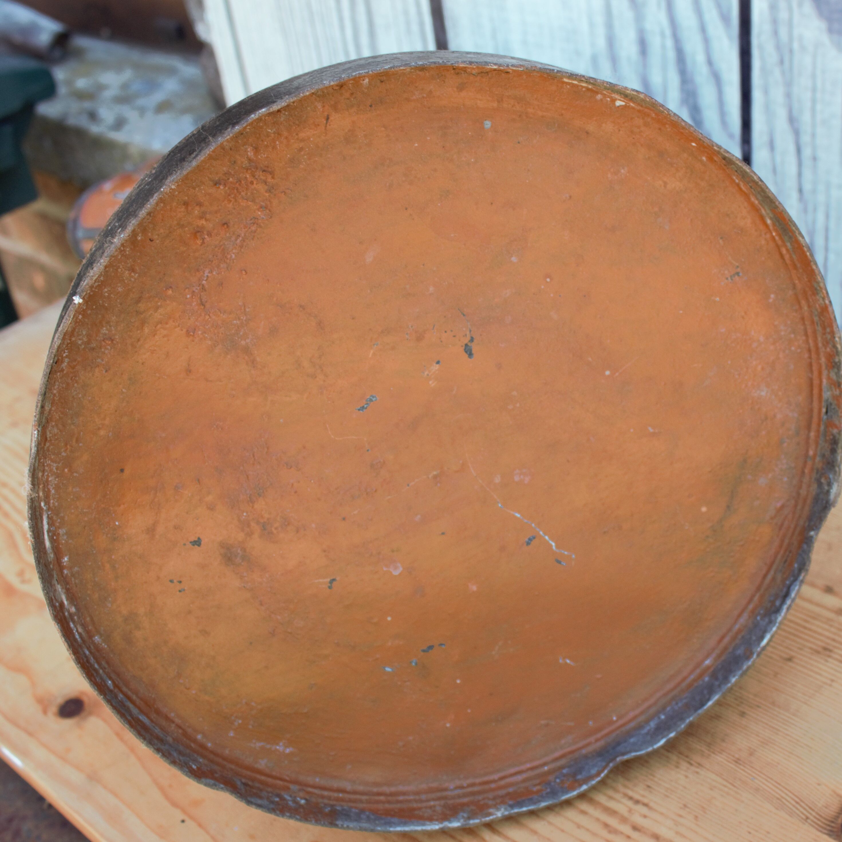 Old brown metal pitcher from France