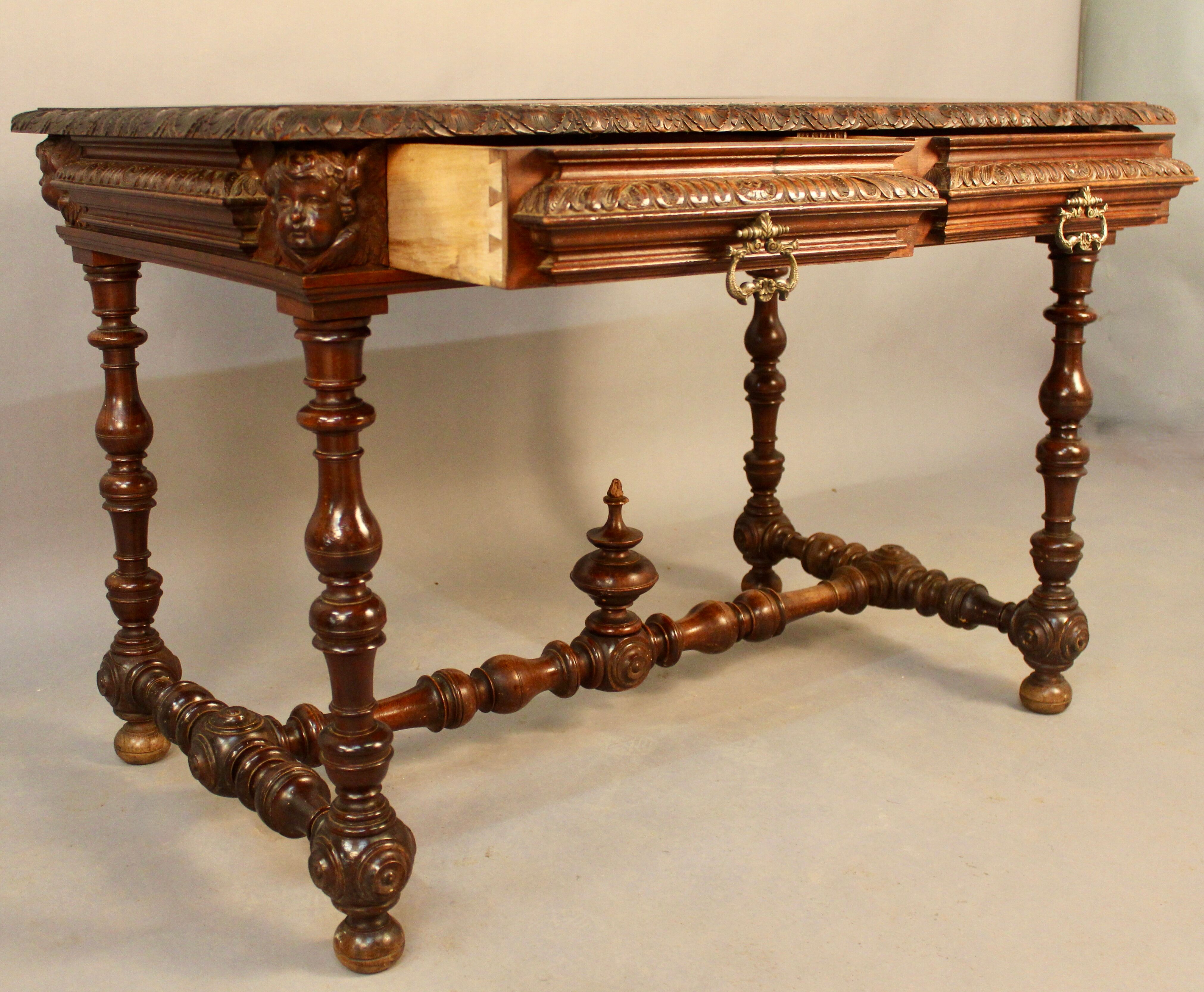 Louis XIII style writing table with Putti decoration