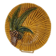 Assiette en barbotine Vallauris A.M. décor palmier