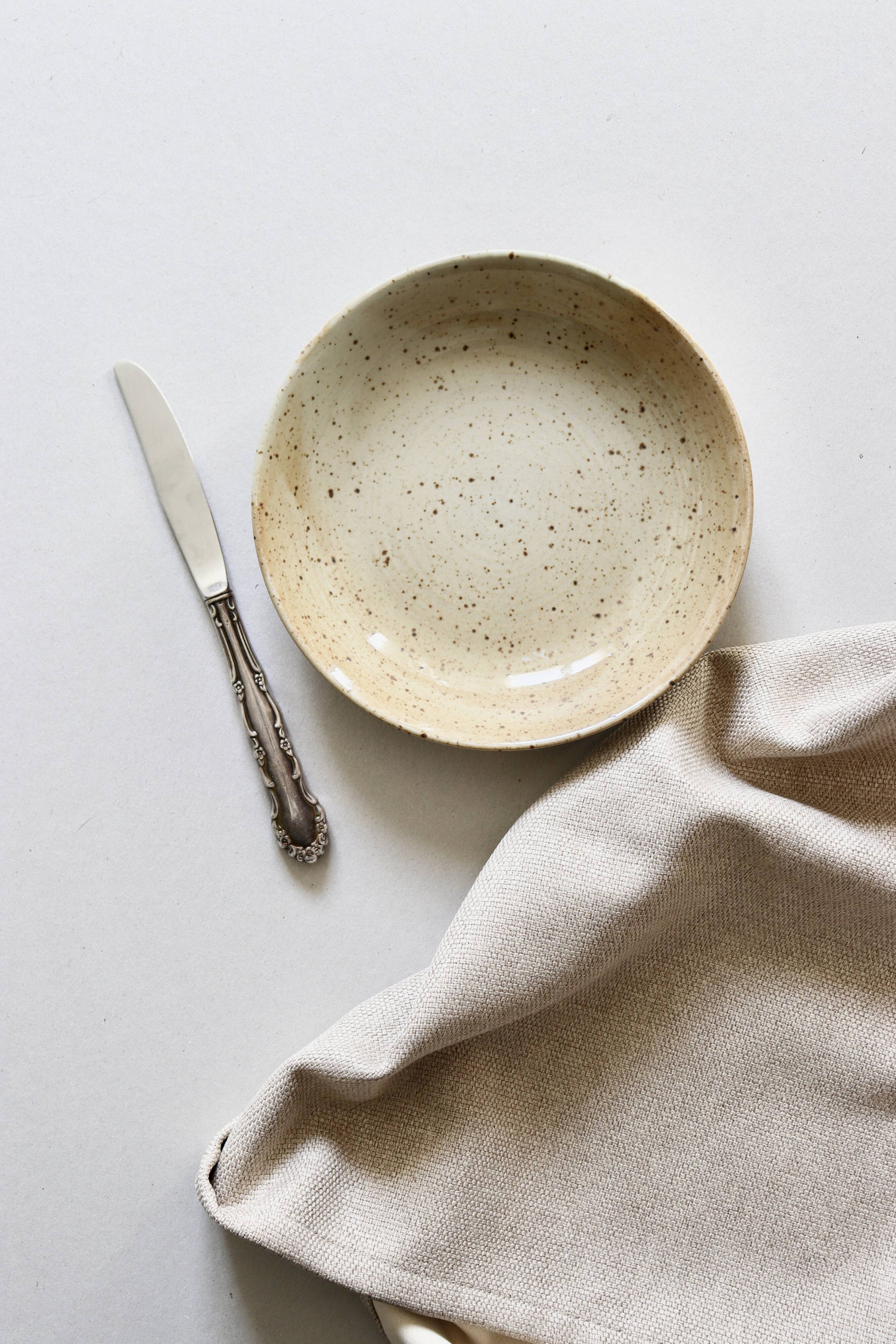 7 speckled stoneware plates
