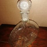 Clear bubble glass bottle molded for easy manual gripping