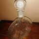 Clear bubble glass bottle molded for easy manual gripping