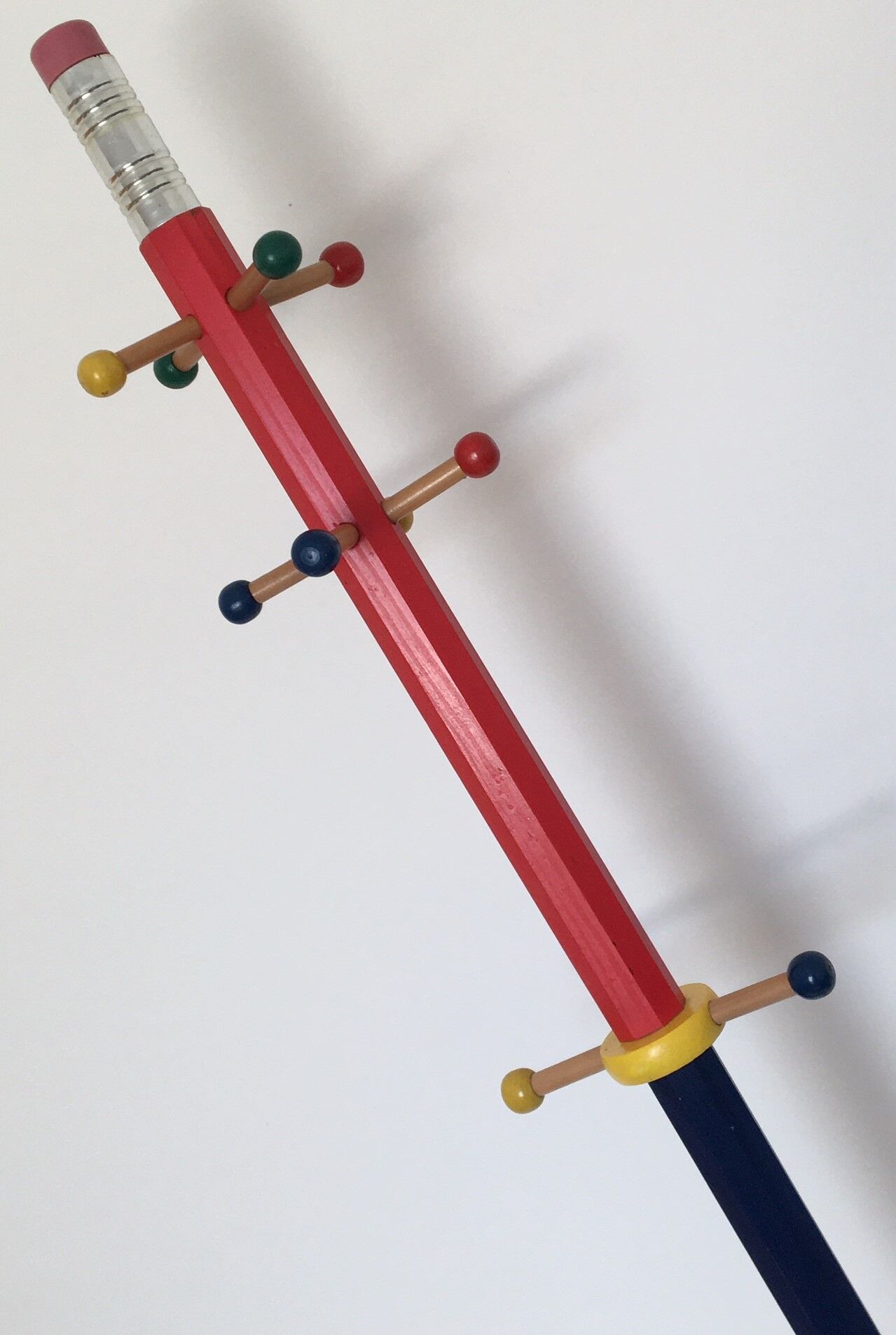 Coat rack in the shape of a pencil