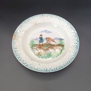 Large antique hollow dish from the 19th century, earthenware with pastoral decoration featuring a child, pig, and goose.