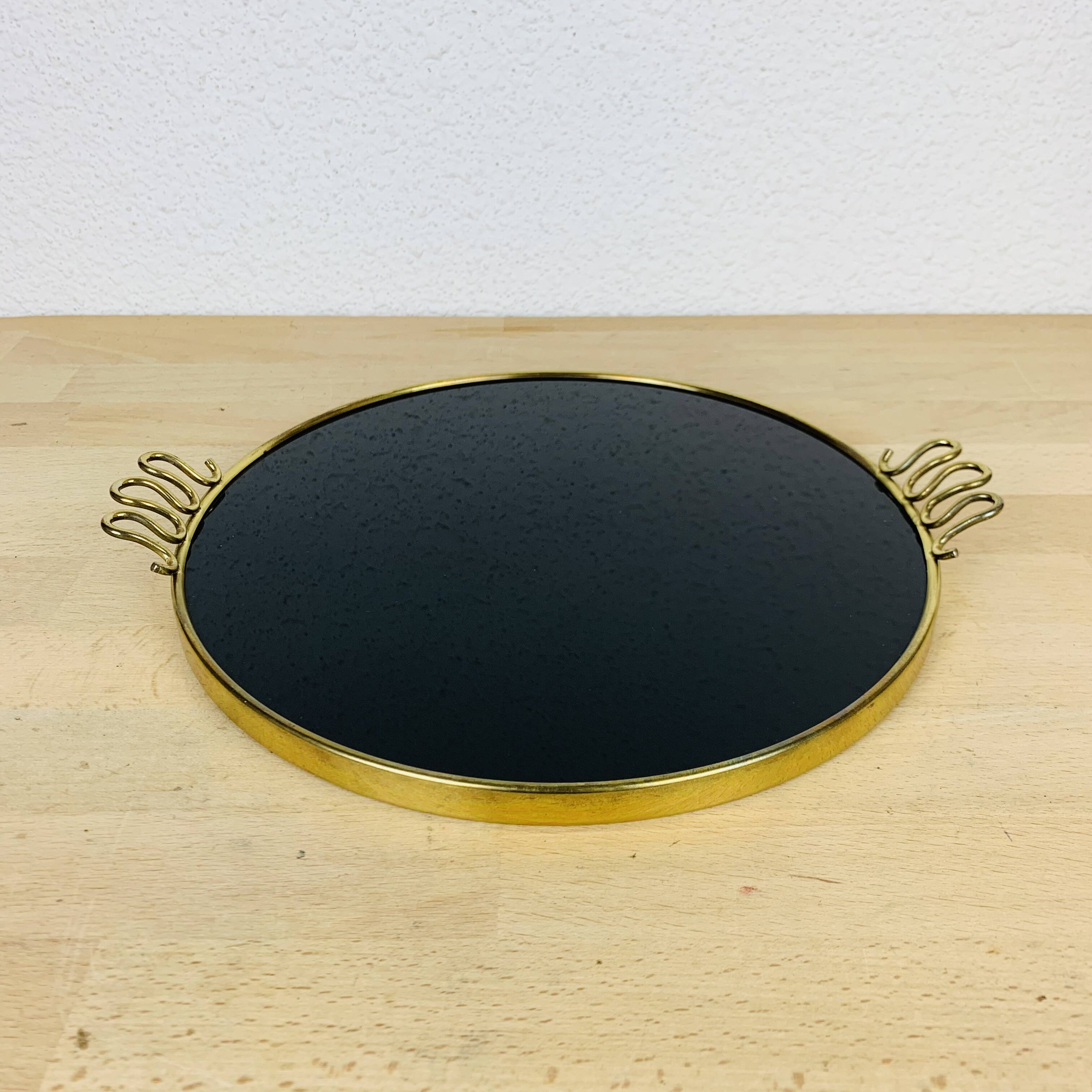 Black and golden brass tray from the 1950s