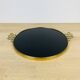 Black plateau and gilded brass from the 1950s.