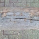 French country style cast iron bench with old rustic wooden plank