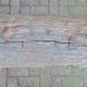 French country style cast iron bench with old rustic wooden plank