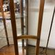 Wooden display case and half-moon mirror