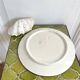 Decorative ceramic plate with griffins