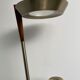 Golden metal floor lamp with reading light
