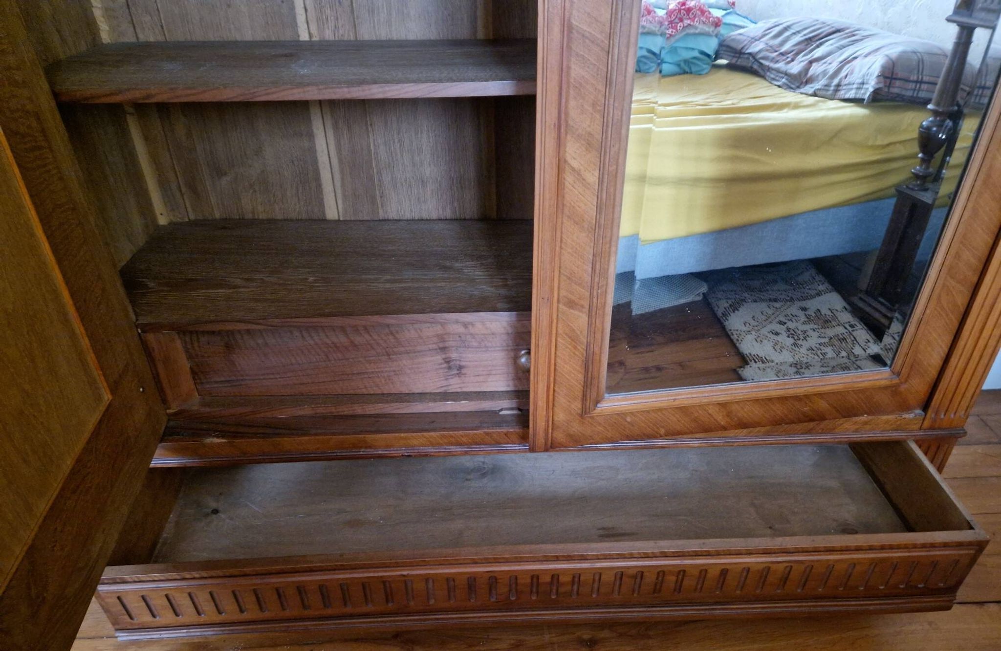 Large antique wardrobe in the Henri II style made of oak and walnut with bevelled mirrors.