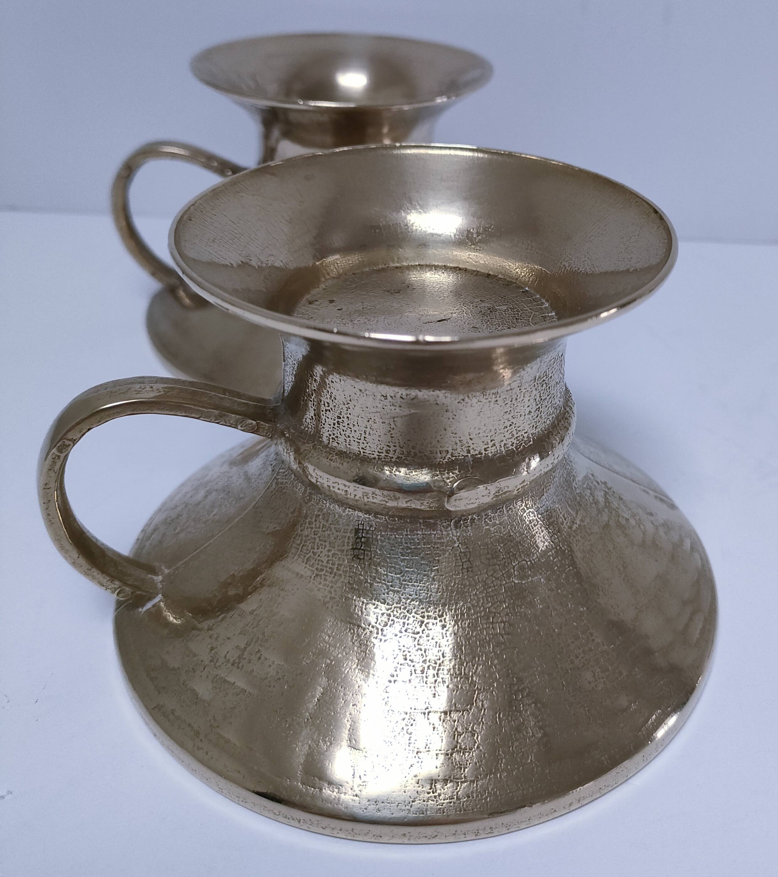 Pair of vintage solid brass hand candlesticks