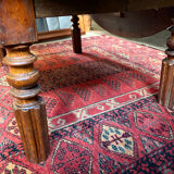 Round oak coffee table with drop leaves and turned legs