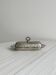 Shiny stainless steel butter dish with lid