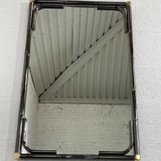 Mirror in black metal and brass with gunmetal finish