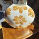 Large vase with golden flowers in ceramic