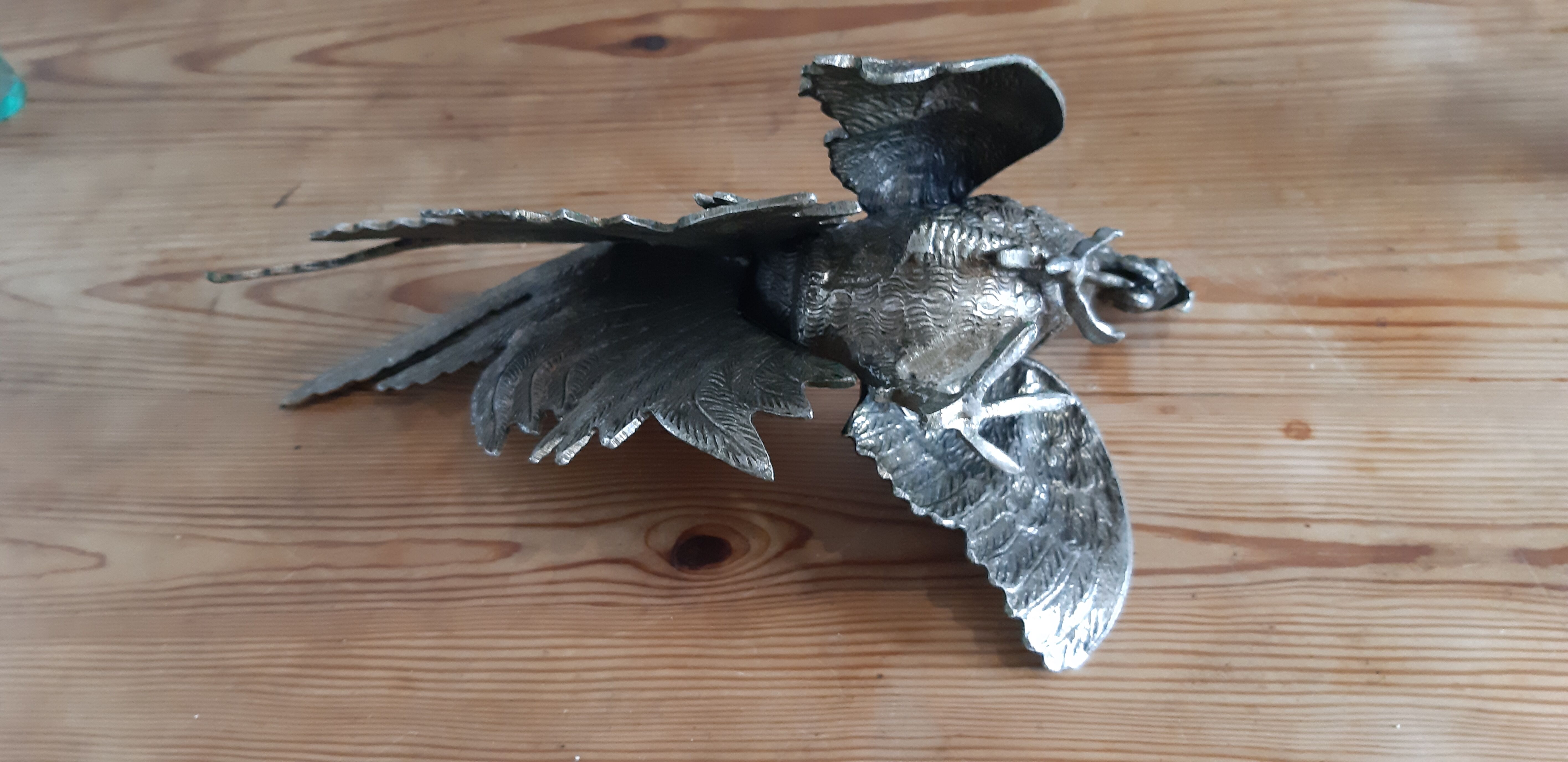 2 silver metal roosters