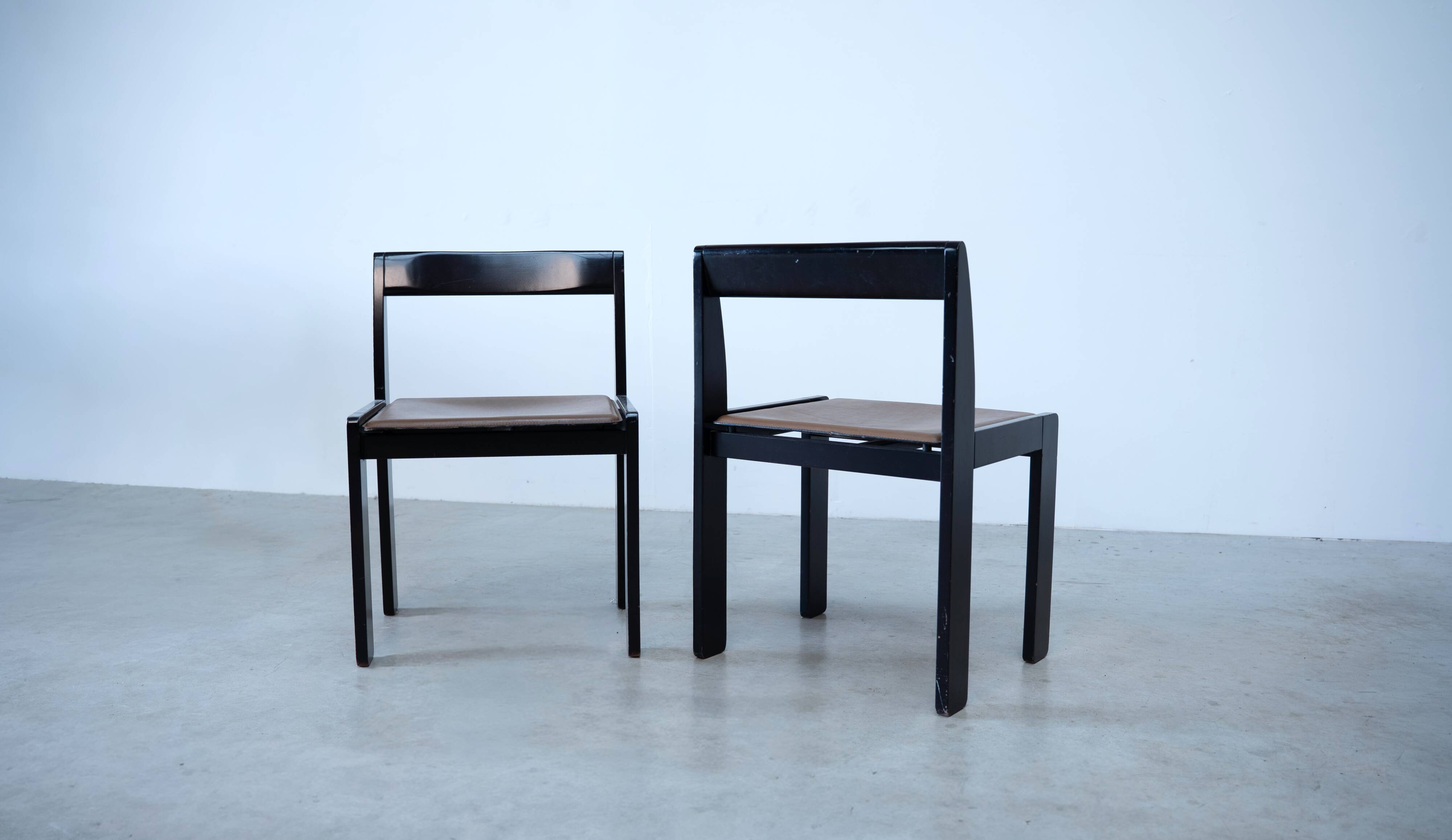 Set of eight black lacquered dining chairs