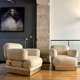 Pair of armchairs by Thibier in brass and wool France 1978