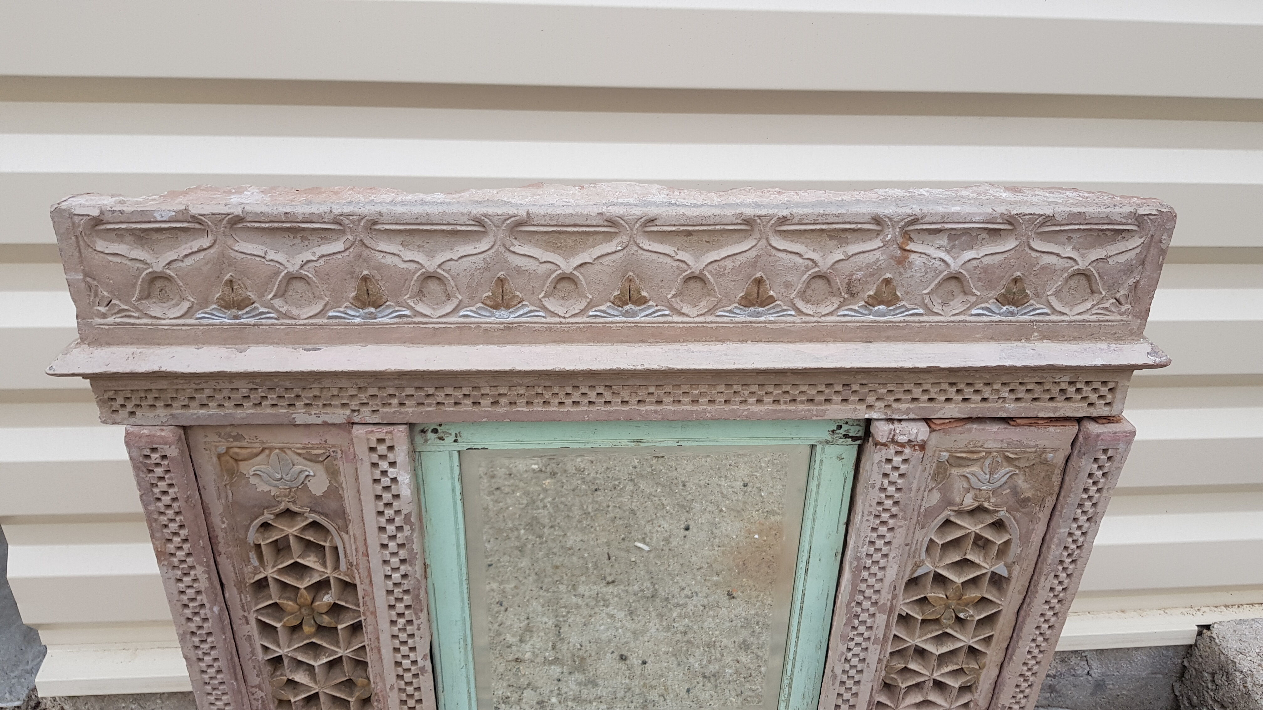 Fully hand-carved stone window with mirror