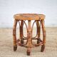 Vintage bamboo stool, woven rattan plant stand, interior decoration.