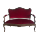 Louis XV style sofa trimmed with red velvet