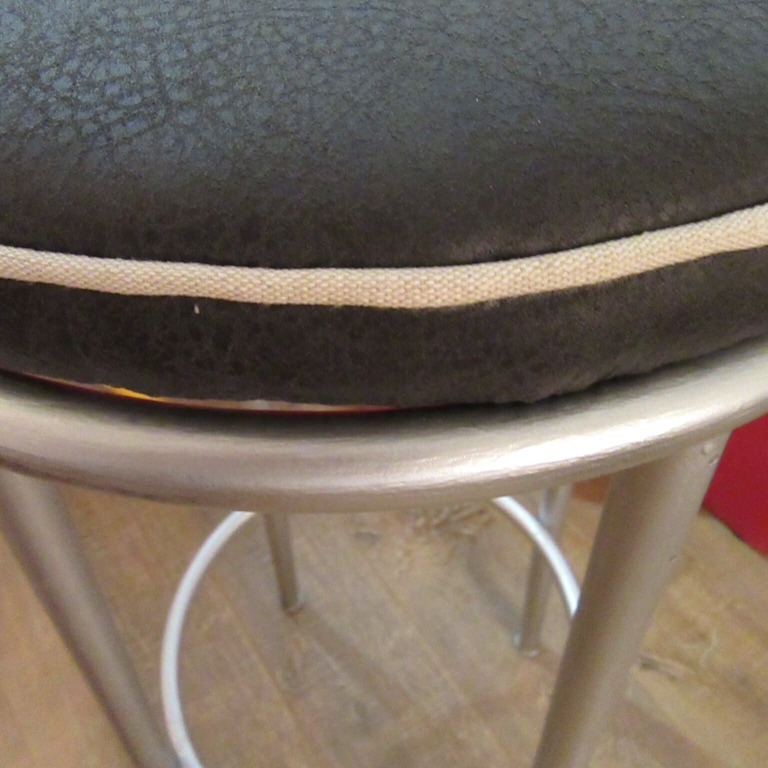 Iron bar stool and black skai seat