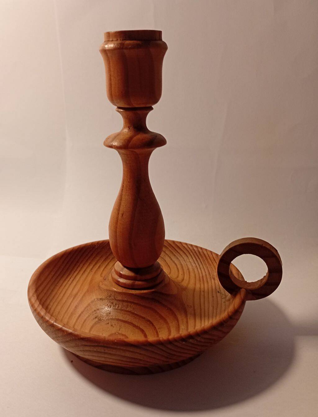 Vintage candlestick holder crafted from turned pine wood Scandinavian-style