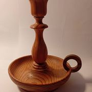 Vintage candlestick holder crafted from turned pine wood Scandinavian-style
