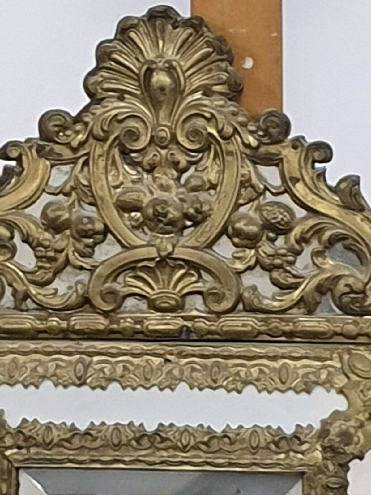 Old bevel mirror with metal parcloses pushed back Louis XIV style