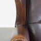 Wing chair made of sheepskin and neatly finished with black piping