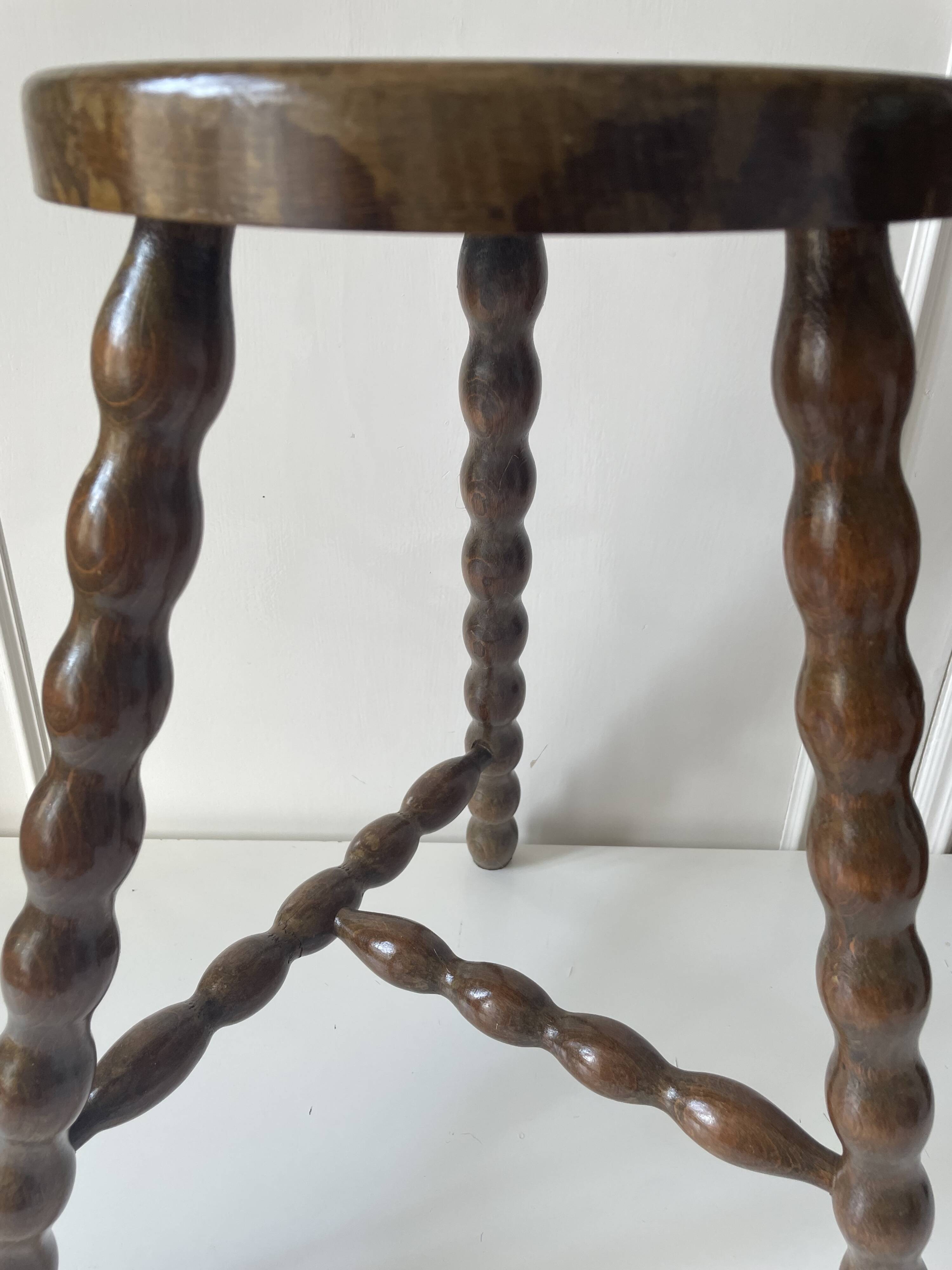 Wooden tripod stool