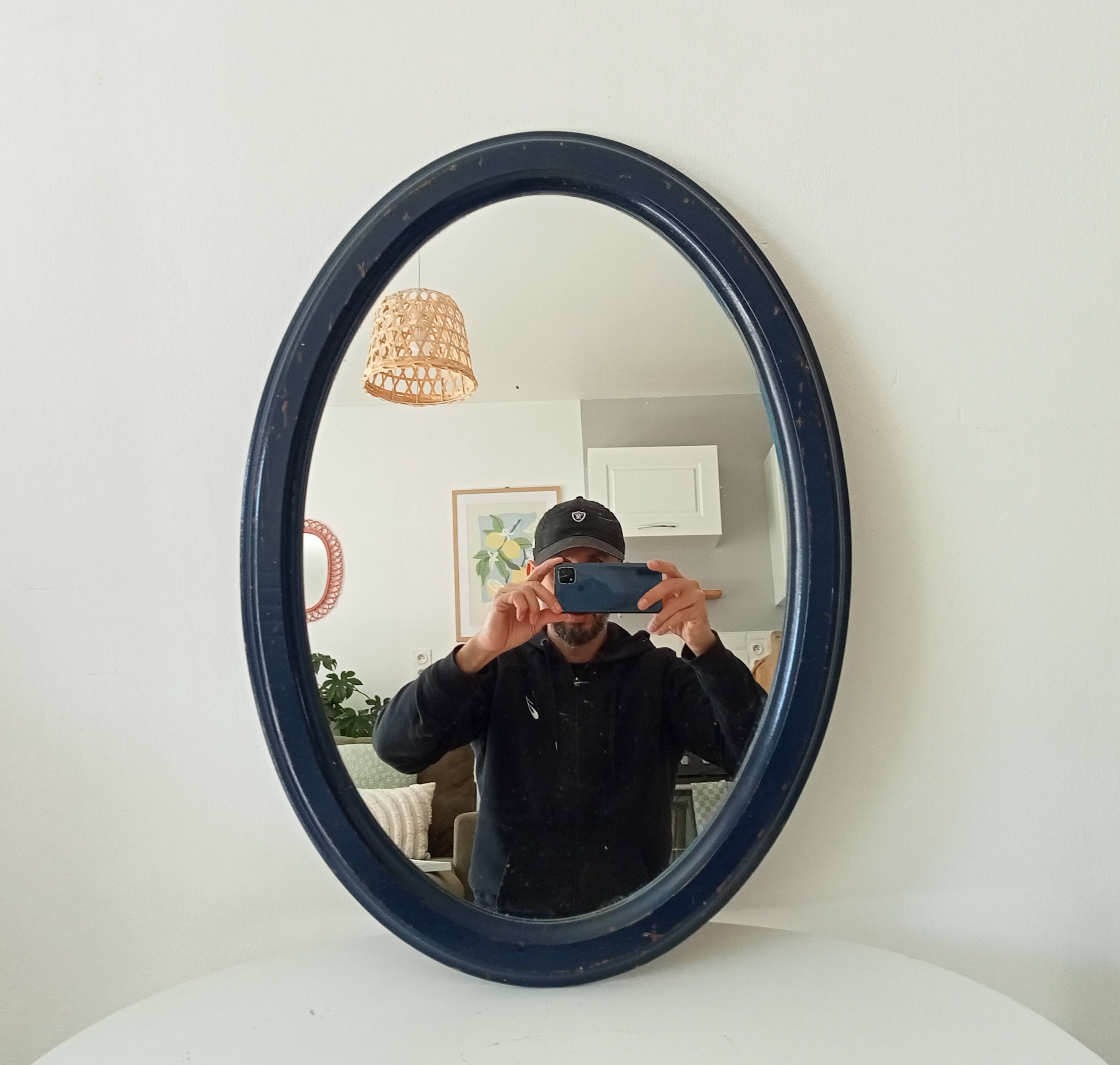 Vintage oval mirror in petrol blue wood