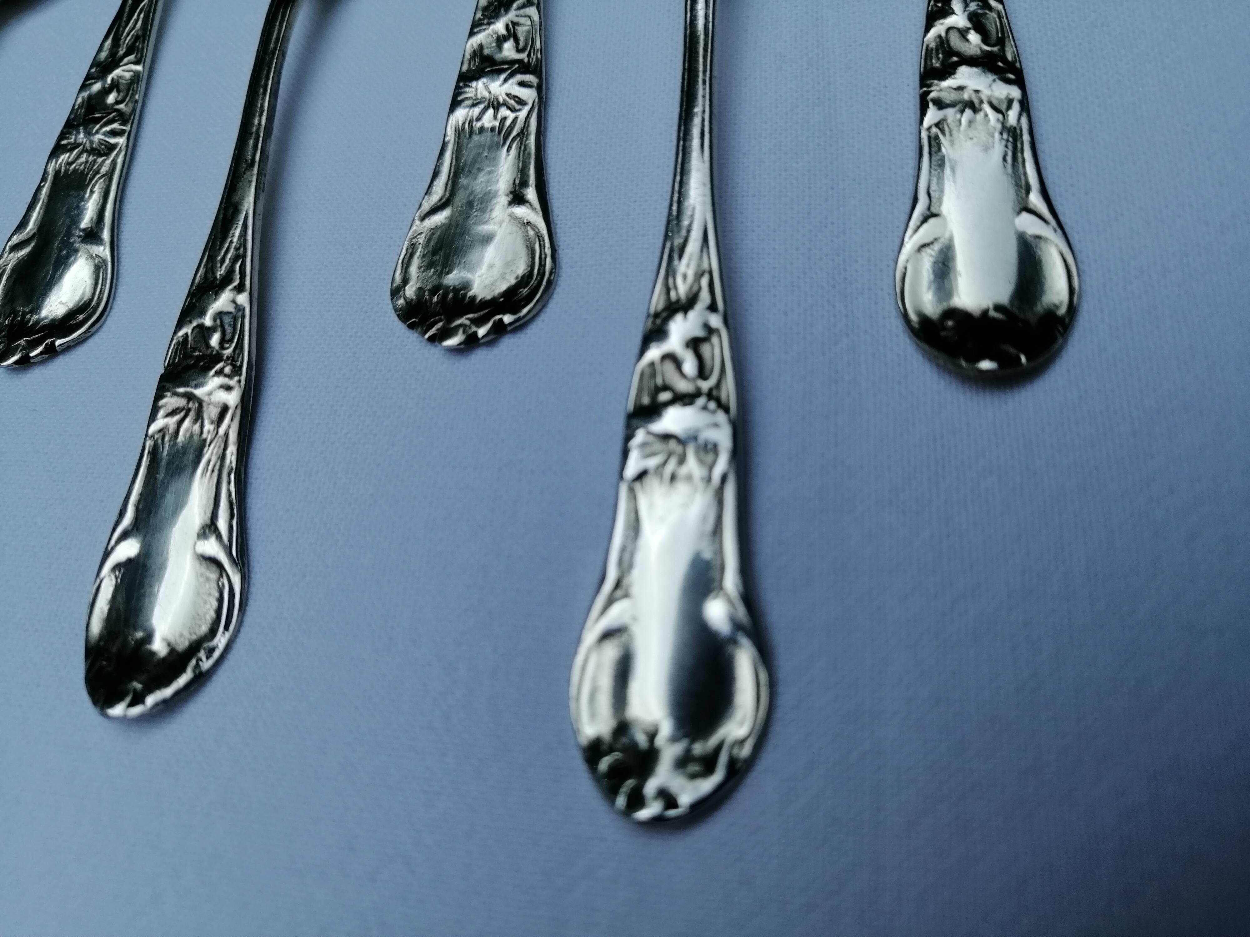 8 small silver spoons