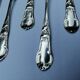 8 small silver spoons