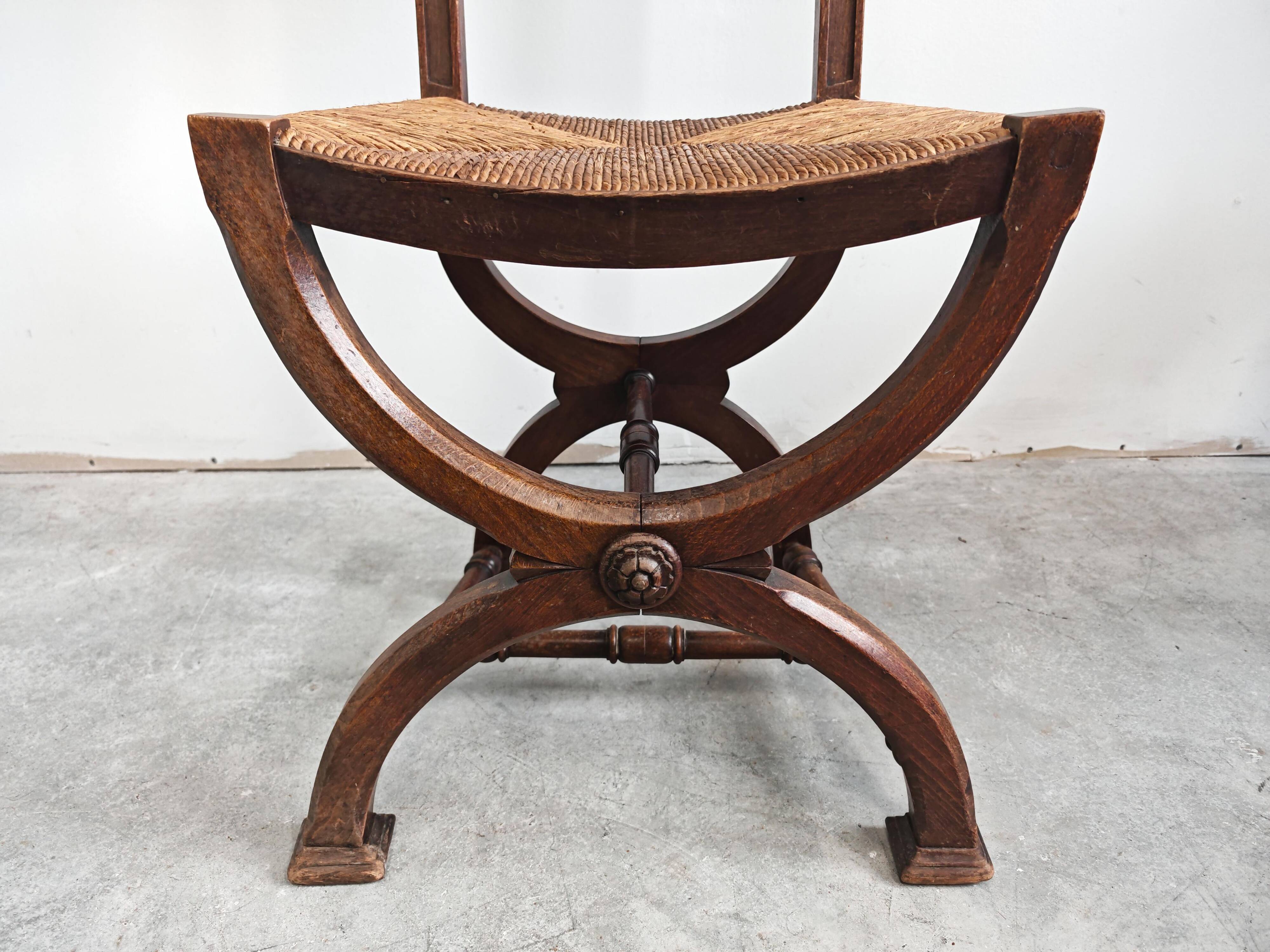 Pair of Neo-Renaissance oak chairs with straw seats, 1910
