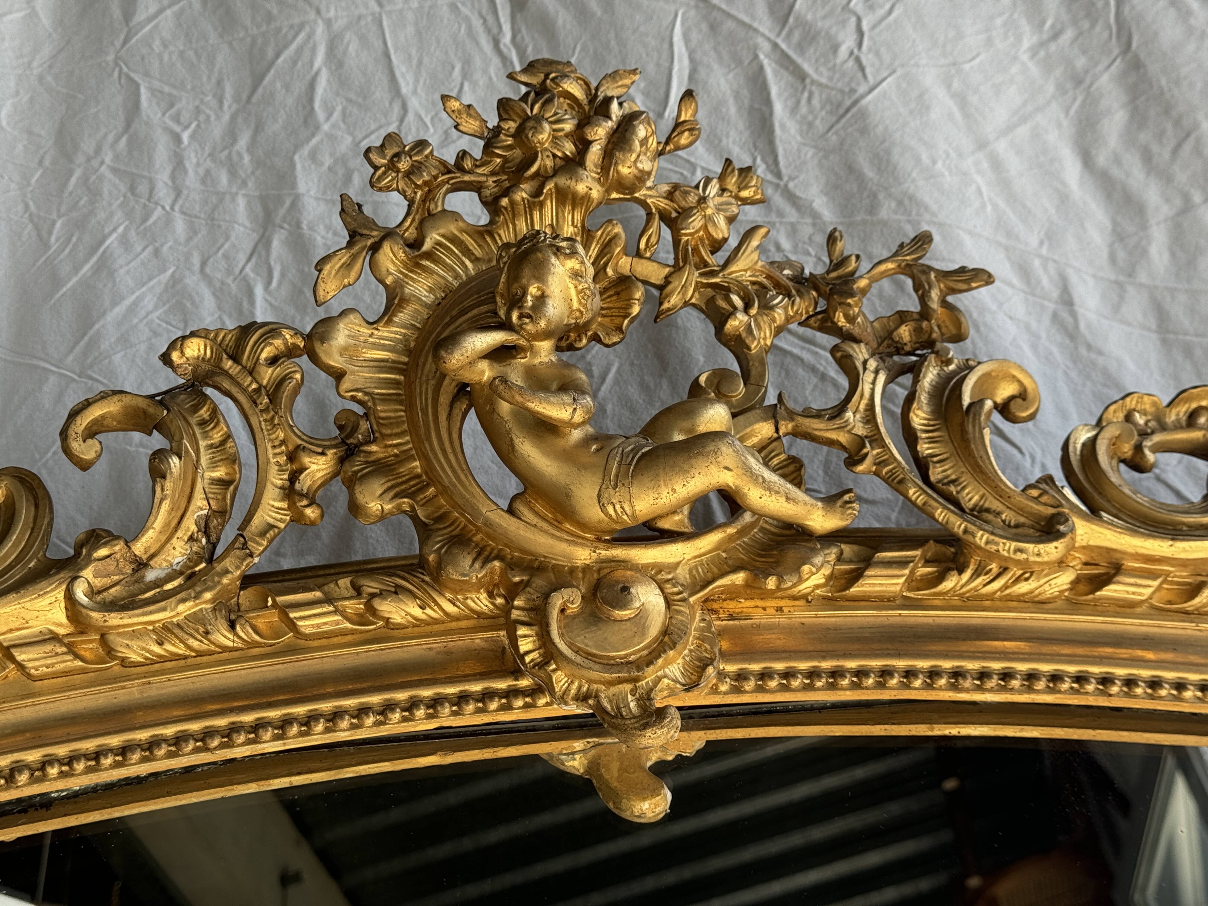 Large gilded mirror with acanthus leaf pediment H150 L98