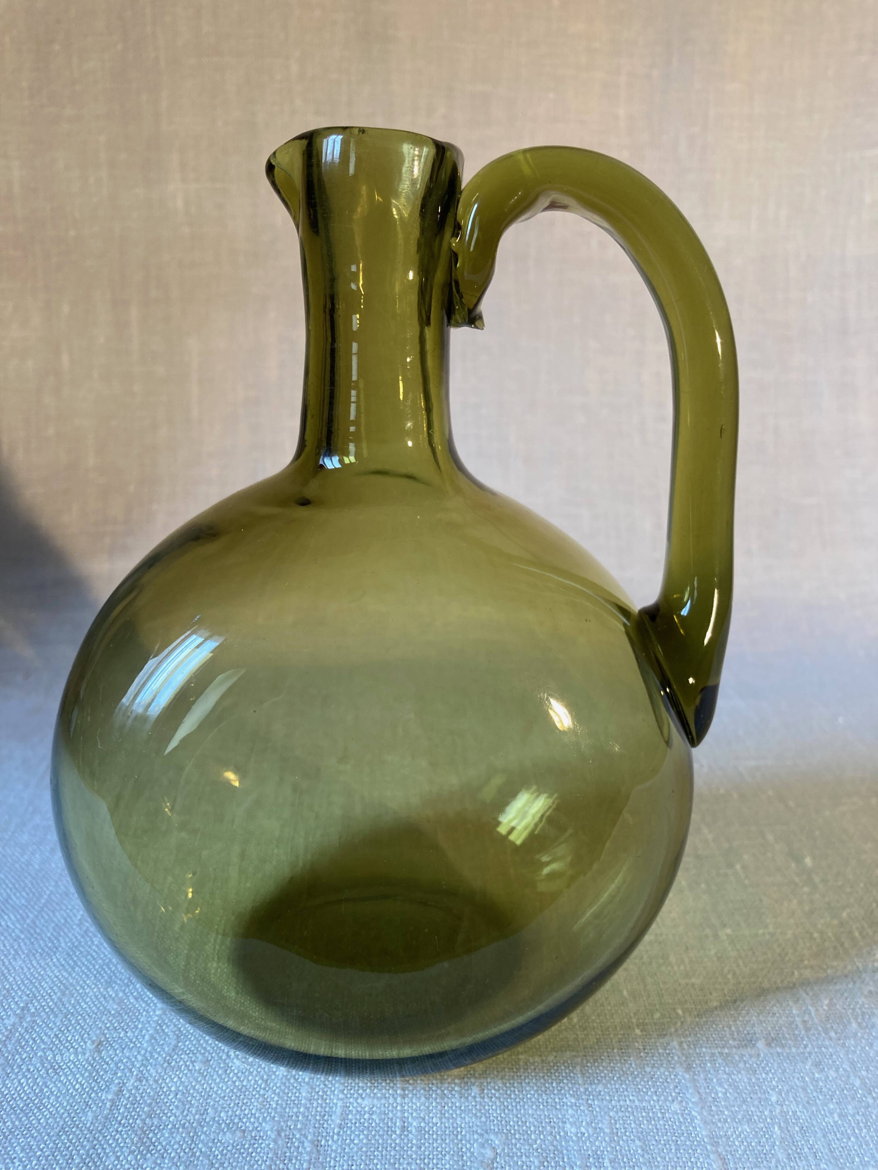 Green blown glass carafe