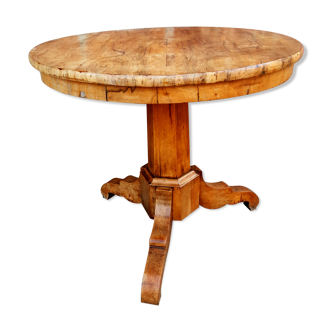 Light wood pedestal table