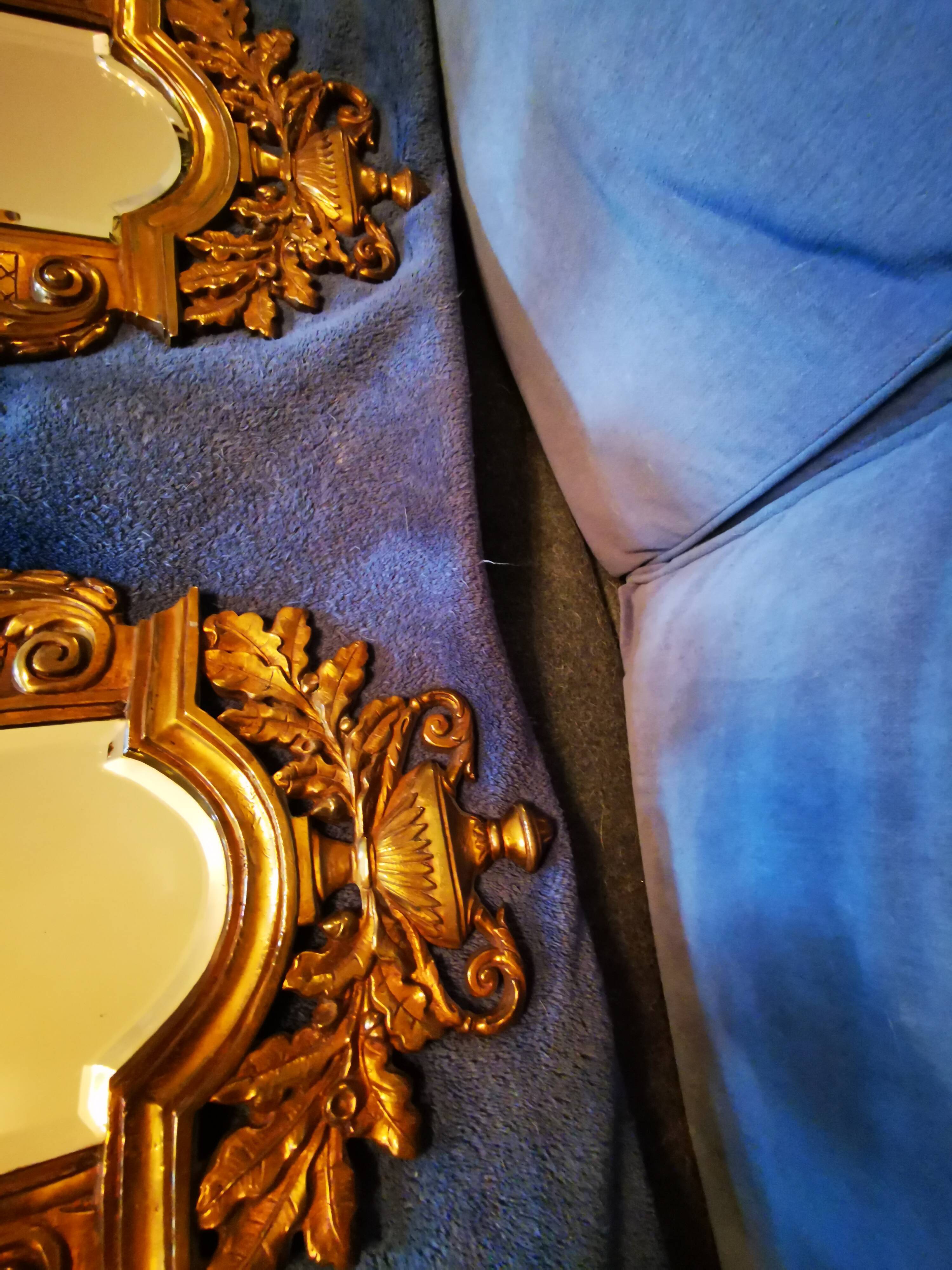 Pair of chissed and gilded bronze mirrors forming appliques