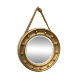 Witch mirror porthole style in gilded wood, diameter 44 cm.