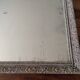 Antique mirror in carved, painted and patinated wood