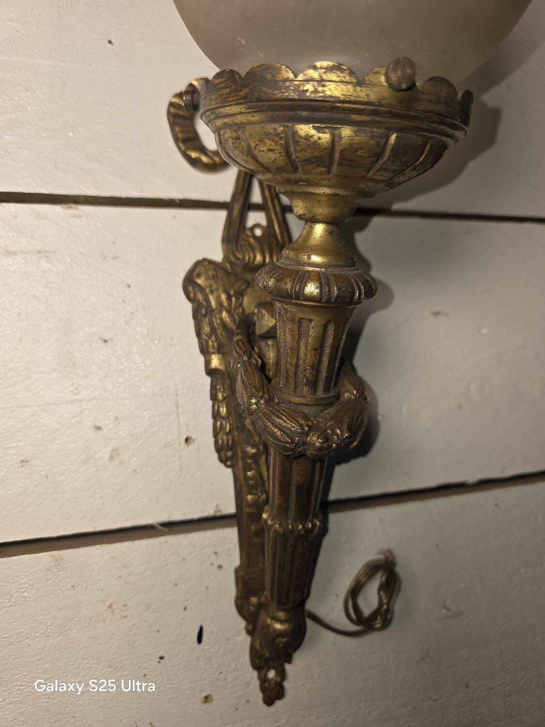 Pair of torch wall lights in Louis XVI style in 19th-century bronze.