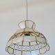 Mother-of-pearl and brass suspension